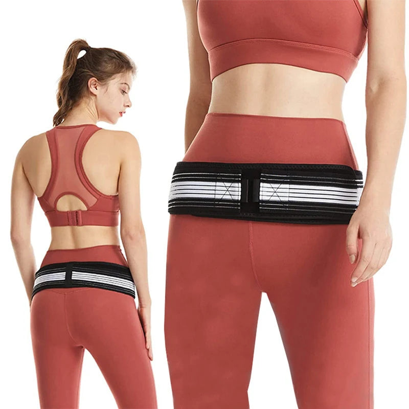Sacroiliac belt worn low on the hips over activewear, front and back view